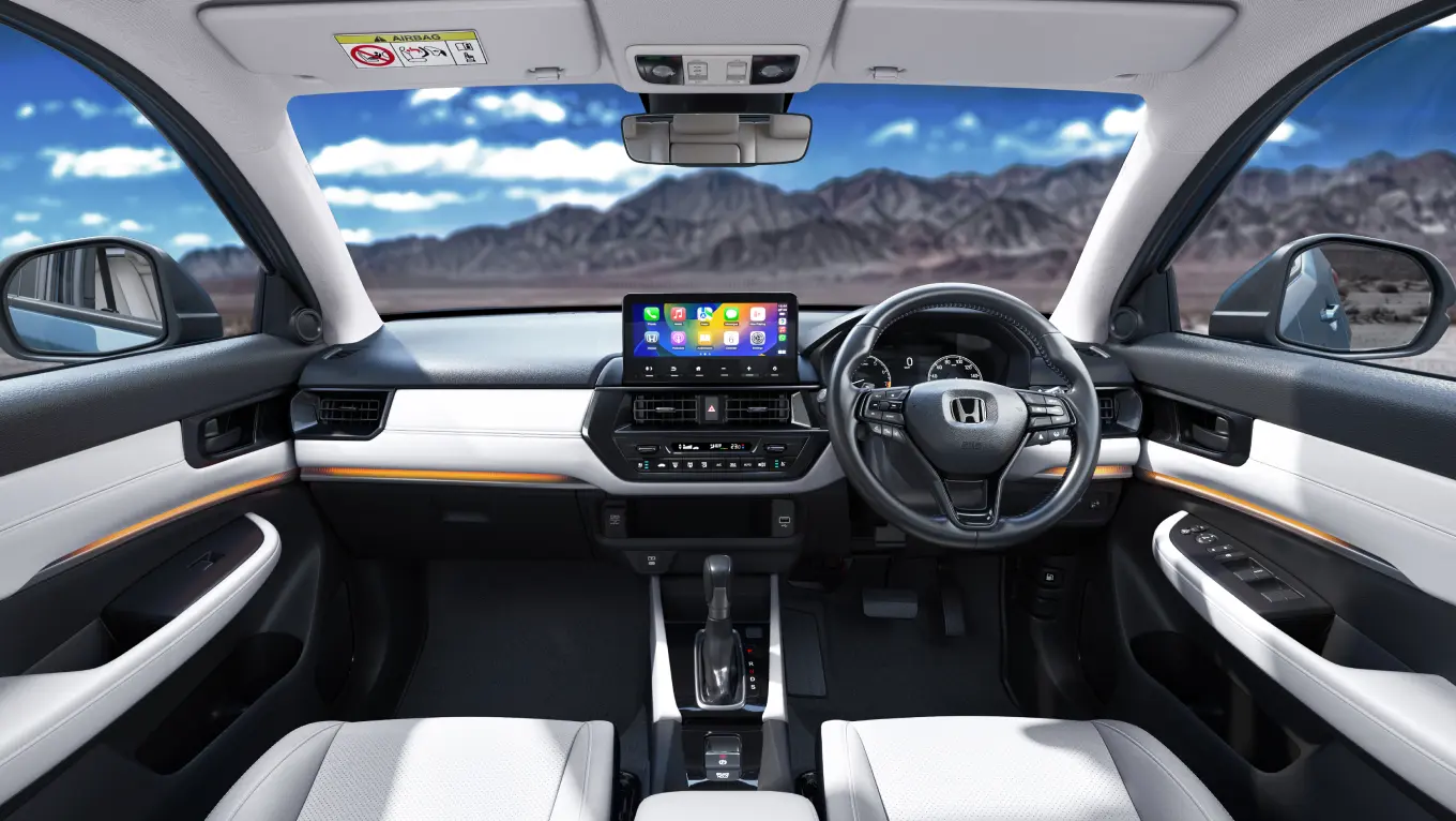 Premium Dual-Tone Ivory-Black Cabin with Soft-Touch Finish